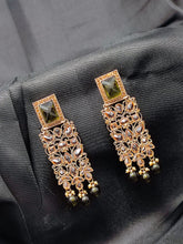 Load image into Gallery viewer, Crayton Gold and Black Contemporary Jhumkas Gold Platted with Artificial Beads Earring
